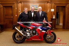 BEM investiture at Government House for Richard ‘Milky’ Quayle at Government House, Isle of Man - pictured with surprise guest John McGuinness and Lieutenant Governor Sir John Lorimer