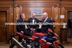 BEM investiture at Government House for Richard ‘Milky’ Quayle at Government House, Isle of Man - pictured with surprise guest John McGuinness and Lieutenant Governor Sir John Lorimer