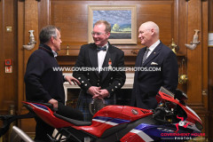 BEM investiture at Government House for Richard ‘Milky’ Quayle at Government House, Isle of Man - pictured with surprise guest John McGuinness and Lieutenant Governor Sir John Lorimer
