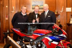 BEM investiture at Government House for Richard ‘Milky’ Quayle at Government House, Isle of Man - pictured with surprise guest John McGuinness and Lieutenant Governor Sir John Lorimer