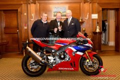 BEM investiture at Government House for Richard ‘Milky’ Quayle at Government House, Isle of Man - pictured with surprise guest John McGuinness and Lieutenant Governor Sir John Lorimer